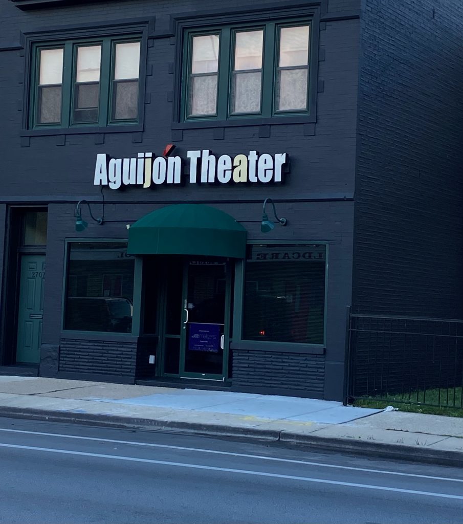 Looking at Aguijón Theater Company from street